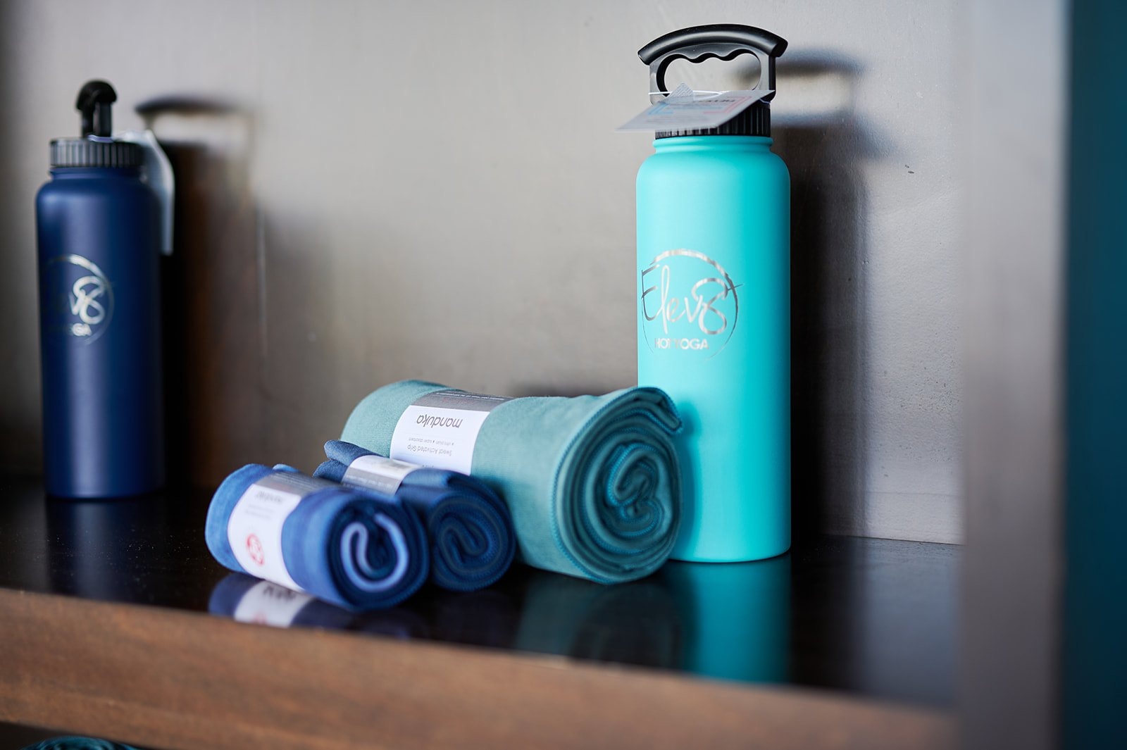 Elev8 branded water bottles and towels
